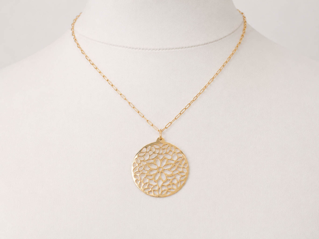 Hand-carved mandala pendant in 18ct yellow gold