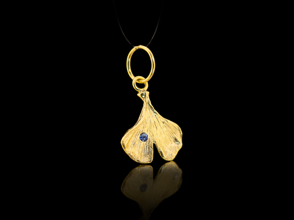 Handmade ginkgo pendant in 14ct gold with blue sapphire