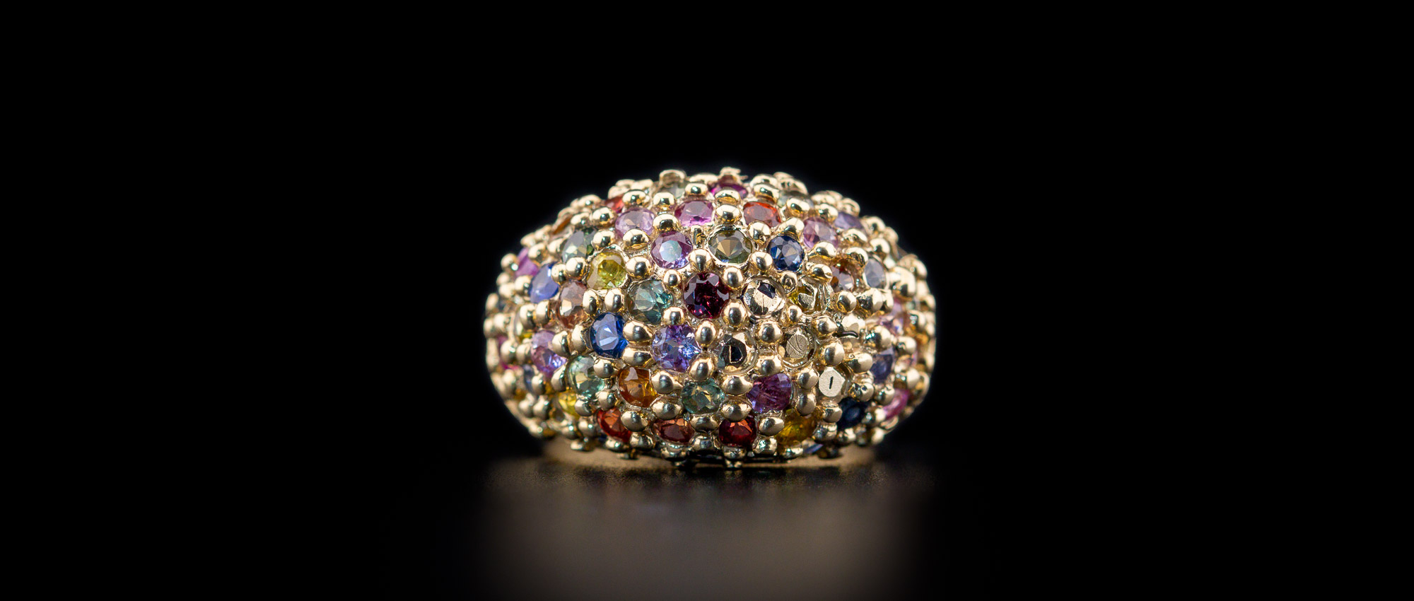 Colourful Sapphires in a chunky Gold ring